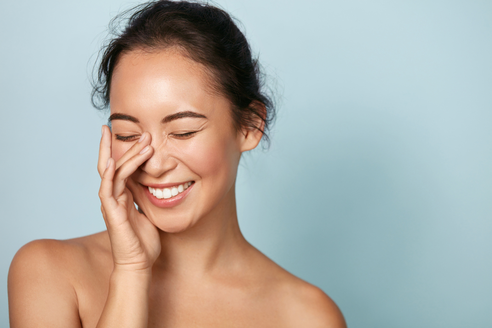 woman happy after skin treatment